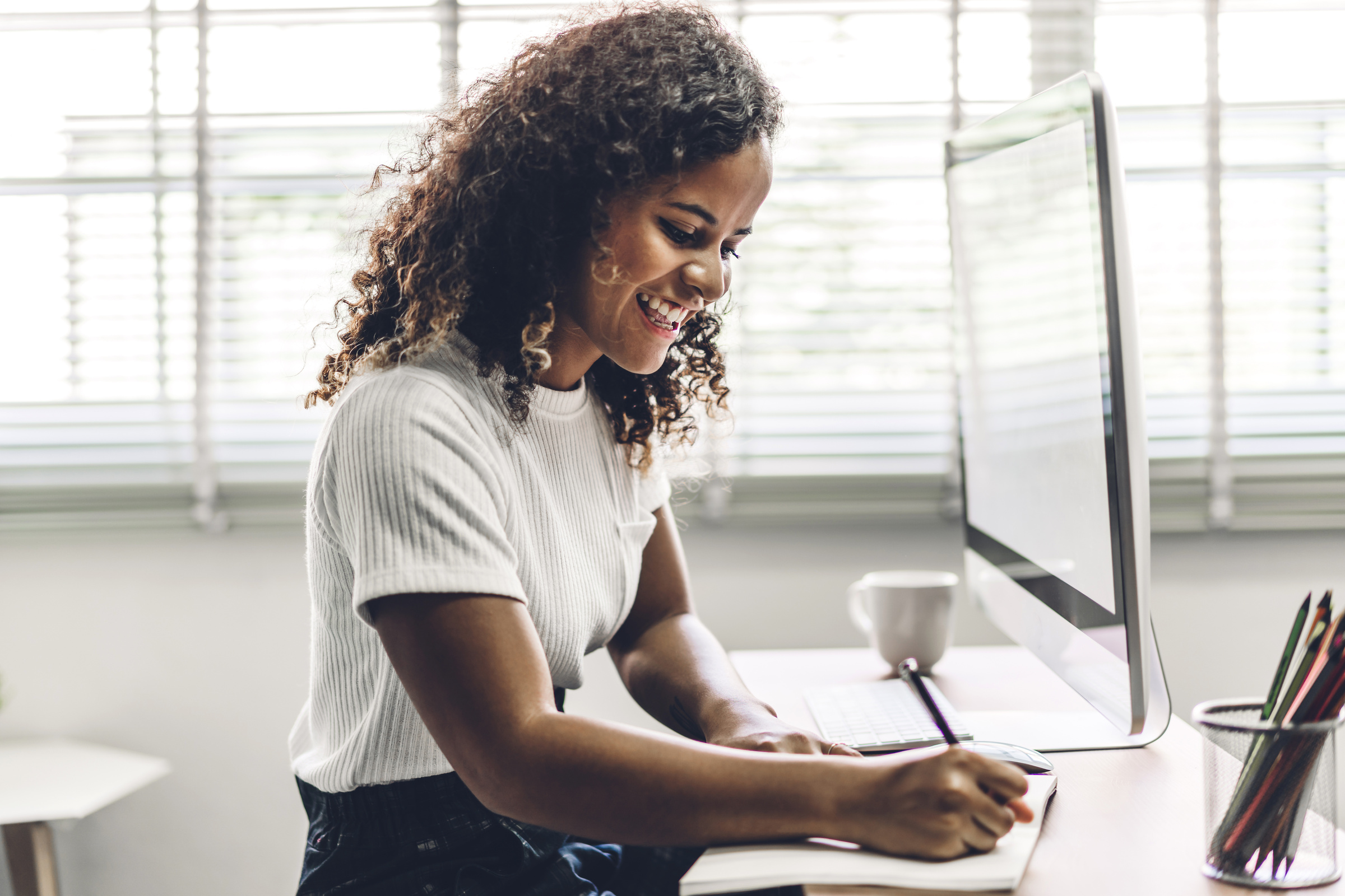 African American Black Woman Working with Laptop Computer.Creati